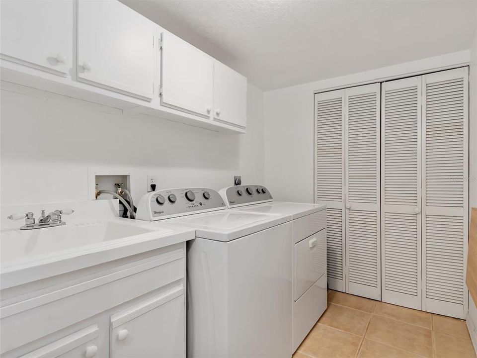 Laundry Room with utility sink and cabinets