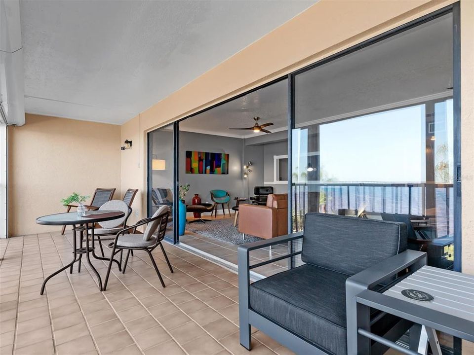 Screened lanai features hurricane shutters and a storage closet