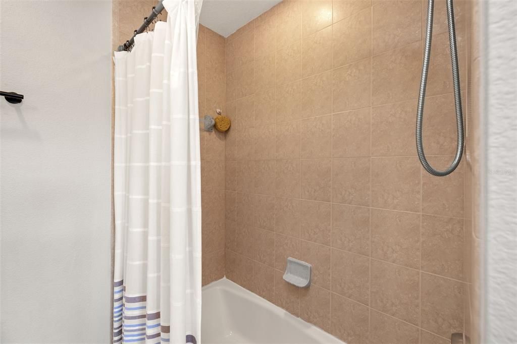 Upstairs Guest Bathroom with Shower/Tub Combo and Skylight