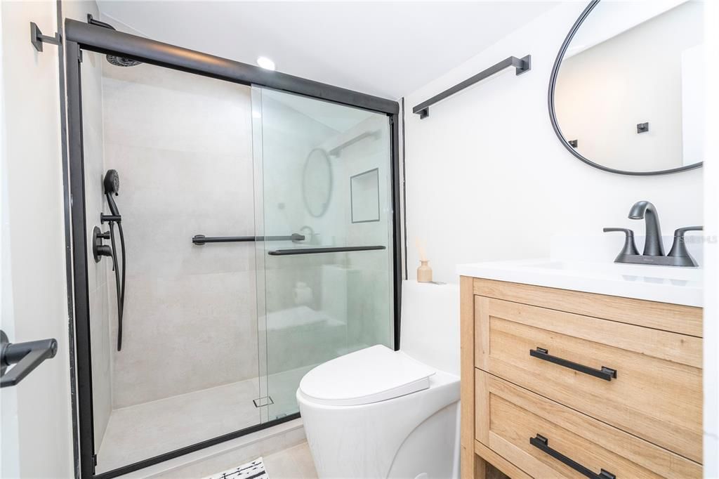 Bathroom with vanity and walk in shower