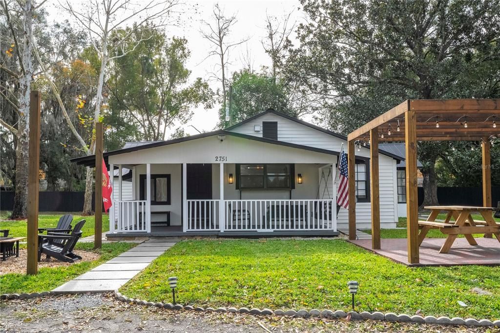 Exterior of the home with a view of the attached porch and pergola