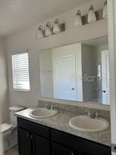 Primary Bath has a dual sink vanity.