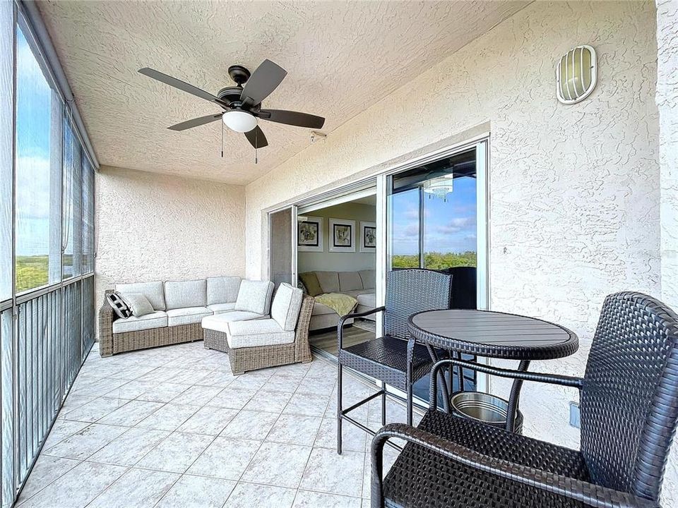 The enclosed balcony offers plenty of sitting room to enjoy the Florida sunsets while sipping on your favorite beverage.