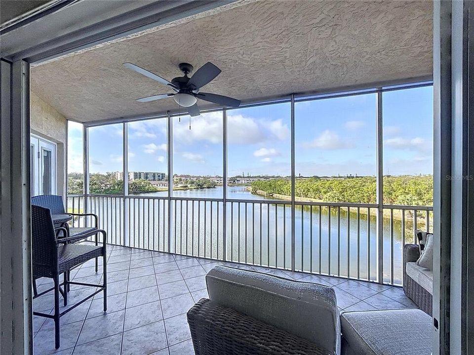 The enclosed balcony offers plenty of sitting room to enjoy the Florida sunsets while sipping on your favorite beverage.