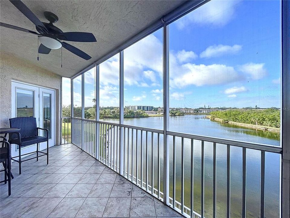 The enclosed balcony offers plenty of sitting room to enjoy the Florida sunsets while sipping on your favorite beverage.