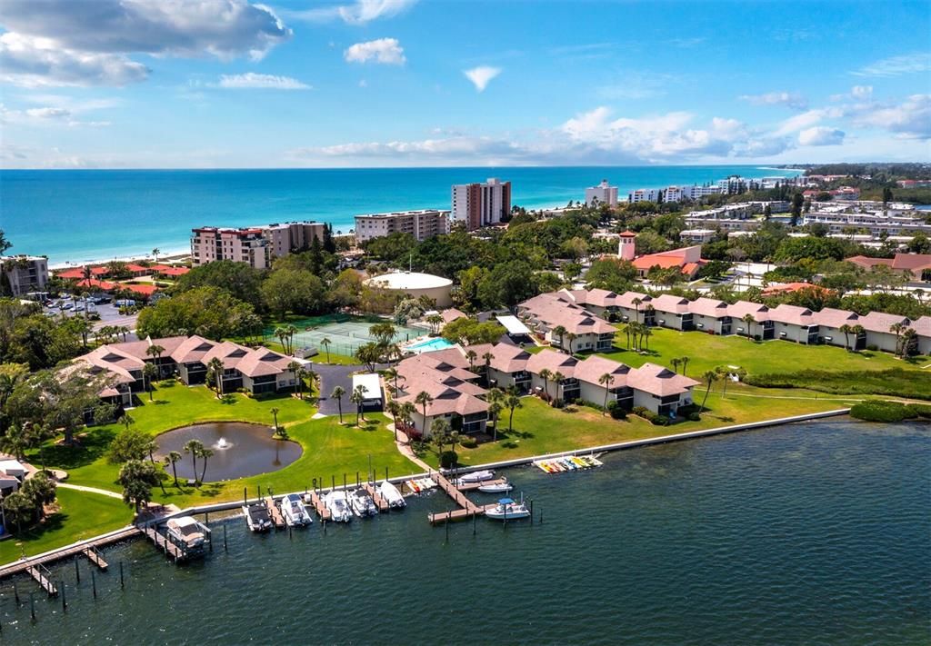 Just on the other side of Gulf of Mexico Drive is the harborside which you have access to the marina, kayak launch and storage, tennis courts, clubroom, and pool.