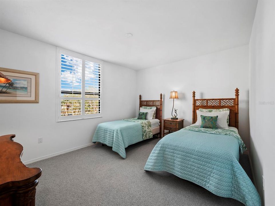 Spacious and Bright with new carpeting, this bedroom offers guests room to relax and a spacious built-in closet to stow their belongings.