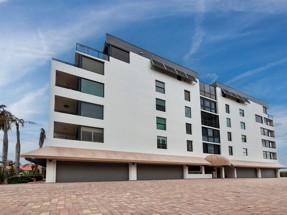 Single Car Garage Space with Direct Stairwell Access ensures you can park and enter the building on a rainy day and stay dry.