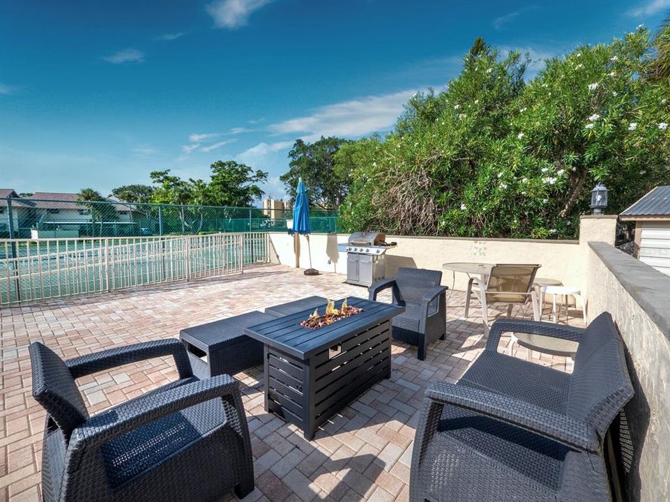 The association amenities also include a grilling area and fire pit, just outside the clubroom, near the courts and community pool.