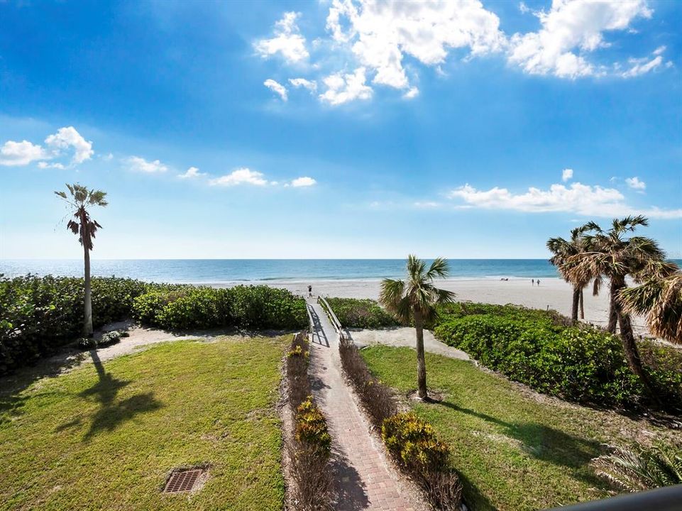 Beyond the balcony, a scenic path guides you to your exclusive deeded beach access.