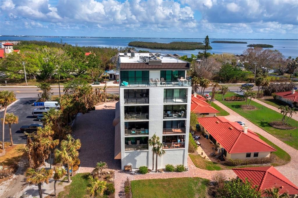 Looking to the east viewing the Gulf side of the condominium, with the scenic backdrop of Sarasota Bay stretching out behind it.