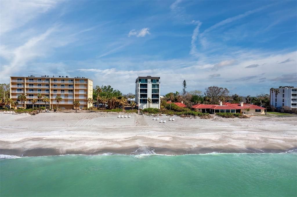 Your "back yard" boasts a pristine beach with soft sand, turquoise waters, and breathtaking sunset views.