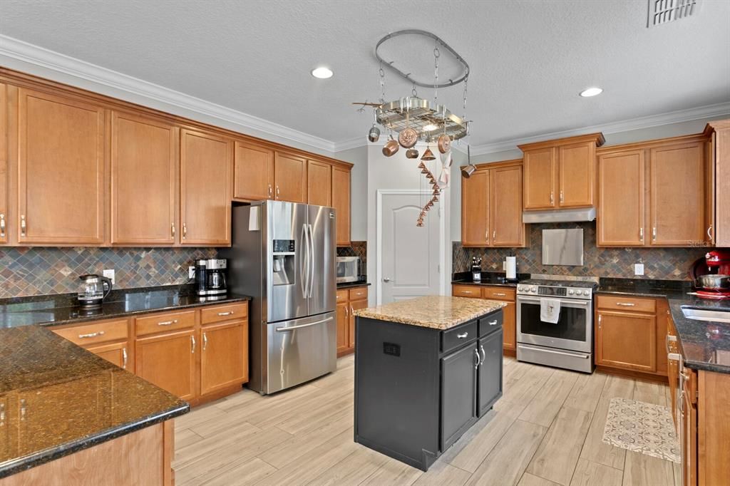 Huge Kitchen With Granite, Wood Cabinets, Stainless Appliances And Eat In Space