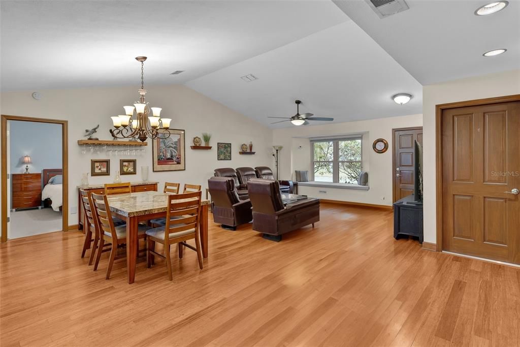 View of family room and dining area with master bedroom off to the left