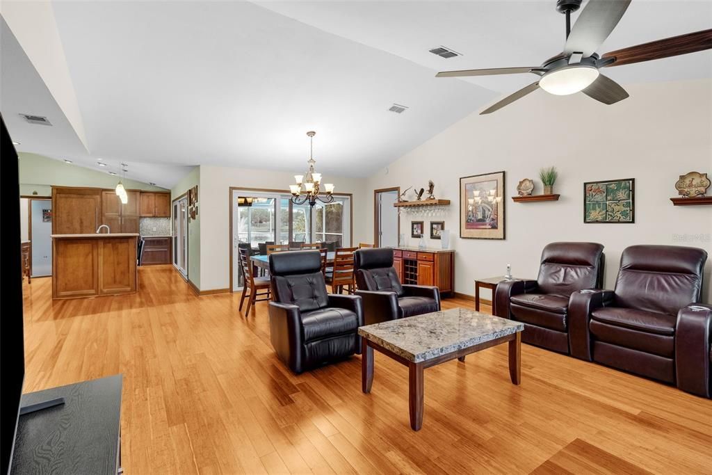 Open view of family room, dining area and kitchen