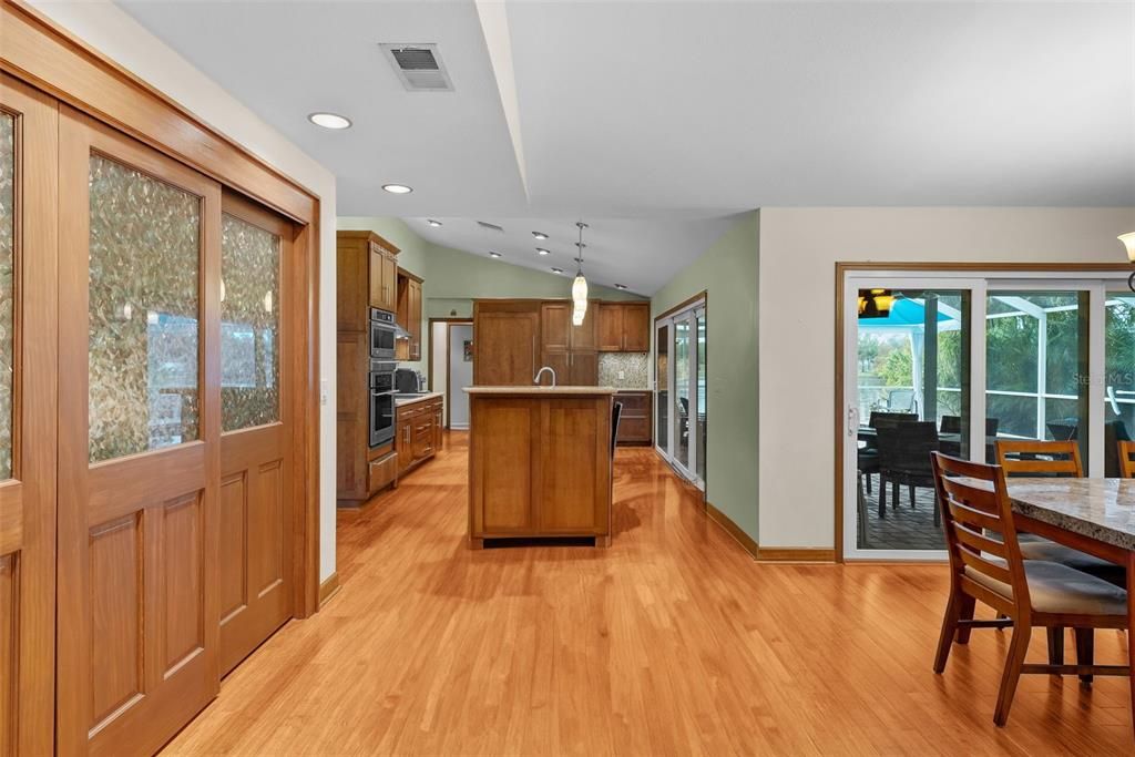 Kitchen view and laundry closet hidden by doors