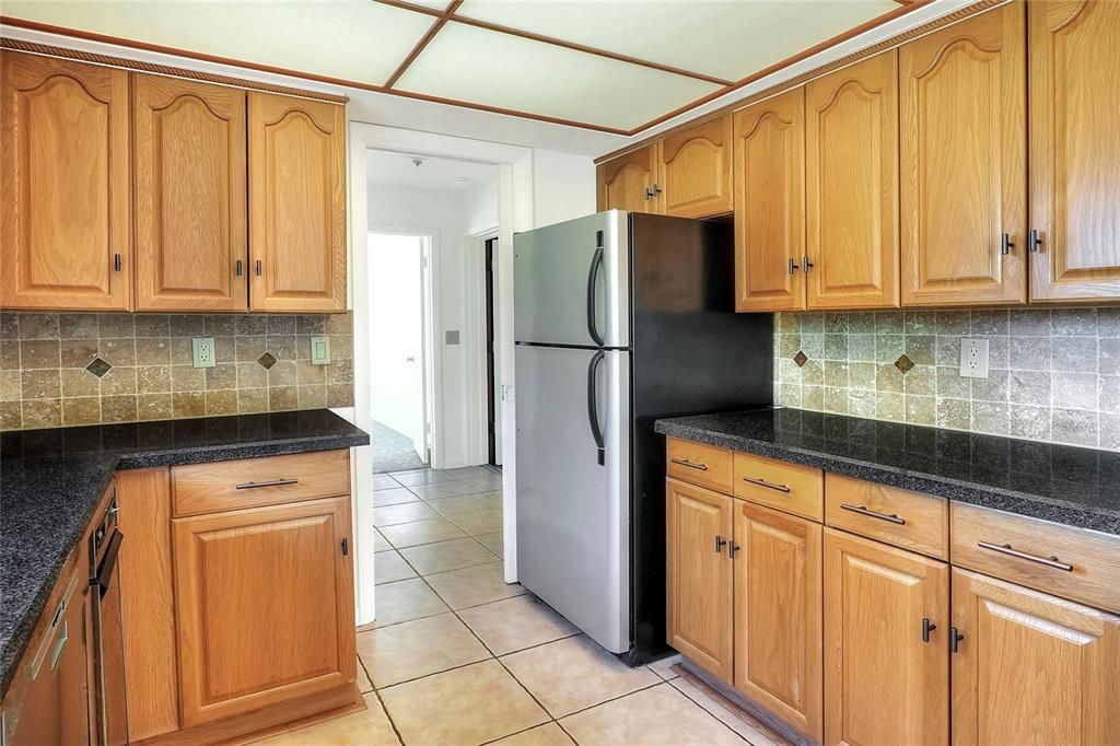 To the nprth end of the kitchen is the laundry area, half bath, 4th bedroom or office, and bonus room.