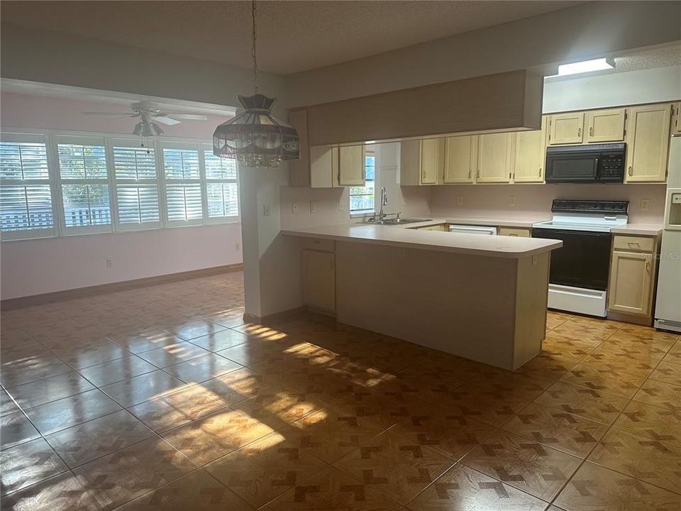 Kitchen looking out to Lanai with Plantation Shutters