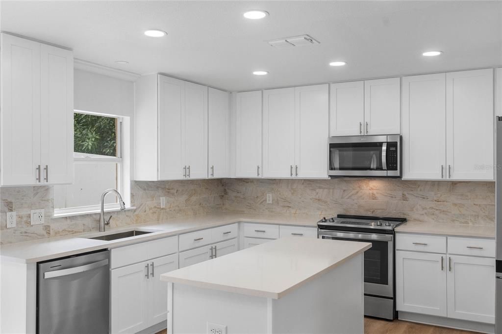 Beautifully updated kitchen with island with storage