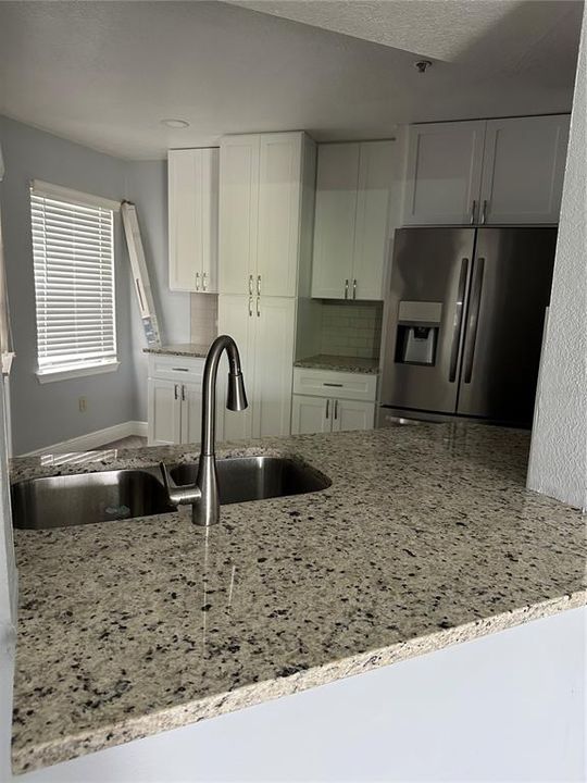 Granite counters throughout entire condo