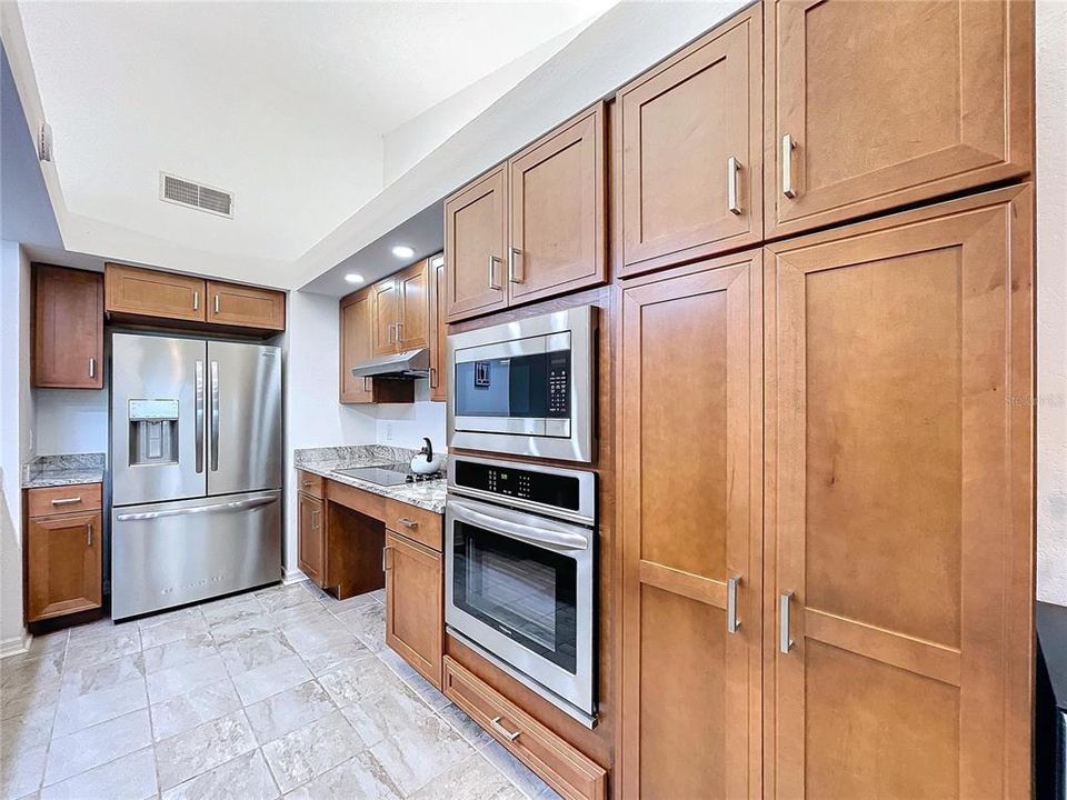 Updated kitchen with solid wood cabinets.