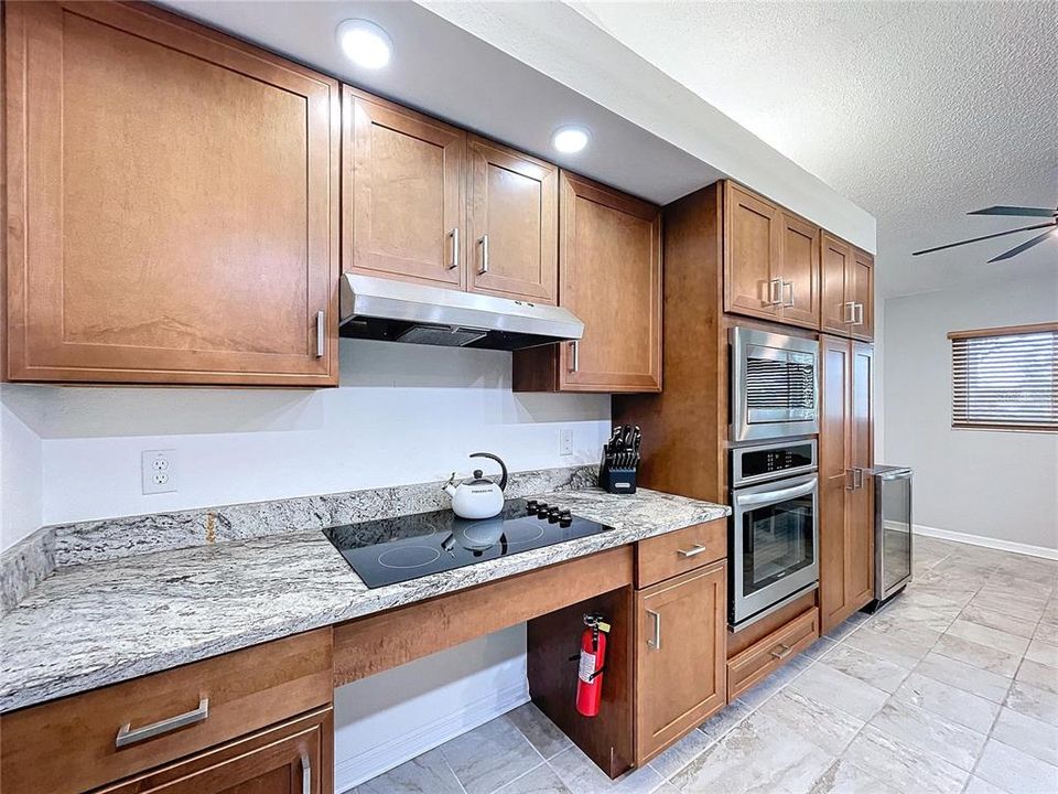 Updated kitchen with handicap accessible cooktop.