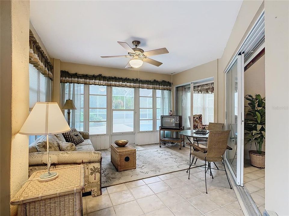 Enclosed Florida Room has 3 sets of sliding glass doors that allows easy access to the home.