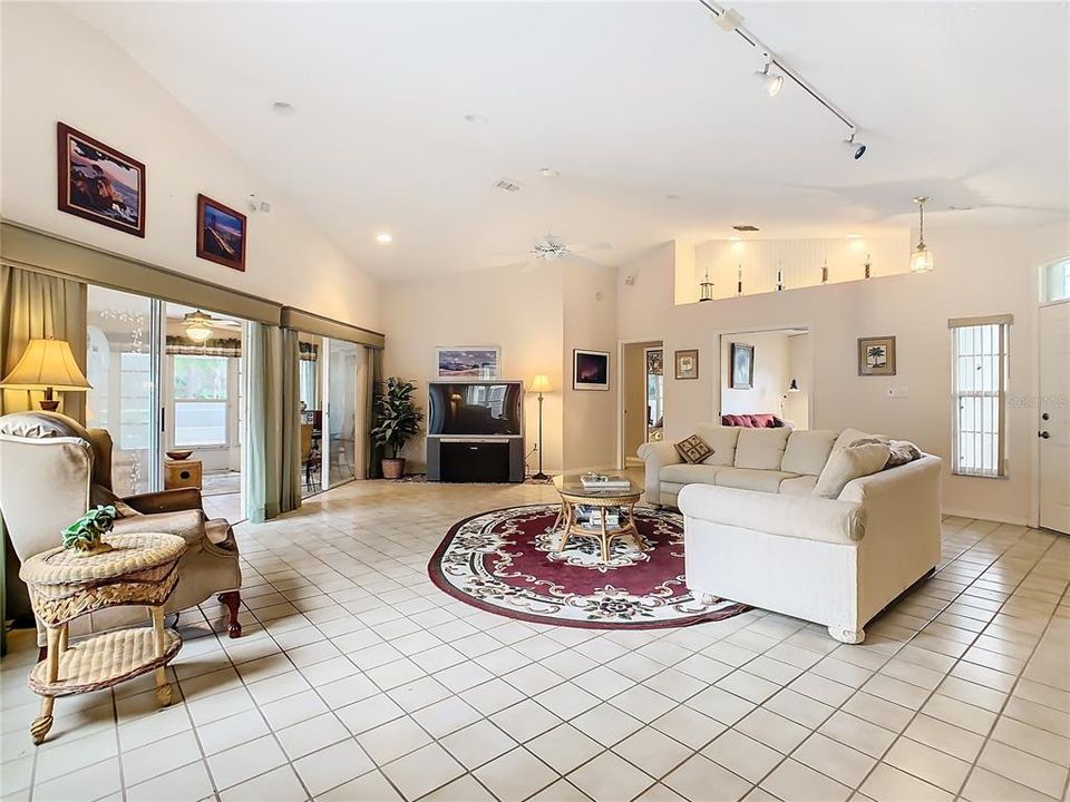 this home boasts a large 24’ x 29’ living room with 2 sets of sliding glass doors opening to the Florida Room.