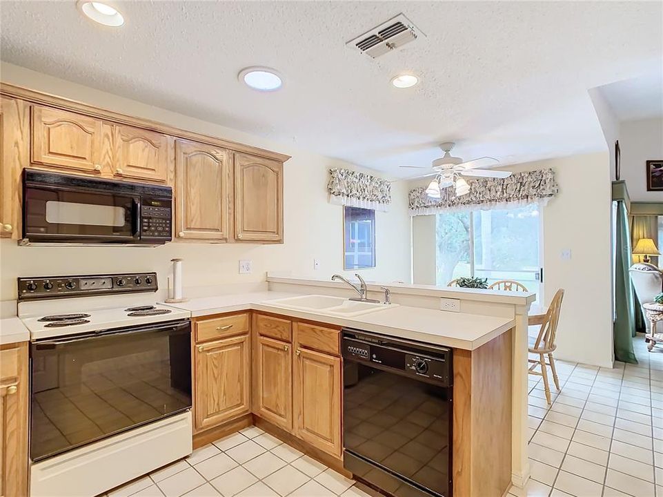 The kitchen and dining room open to the large open living room.