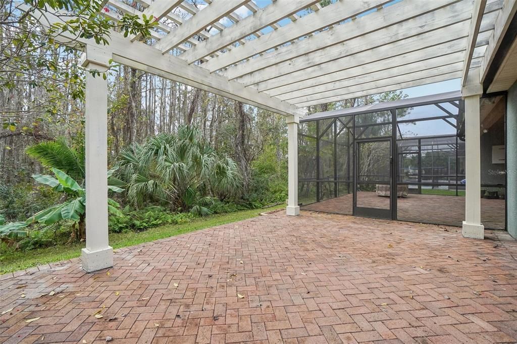 Enjoy plenty of room for entertaining with the additional paved patio with pergola