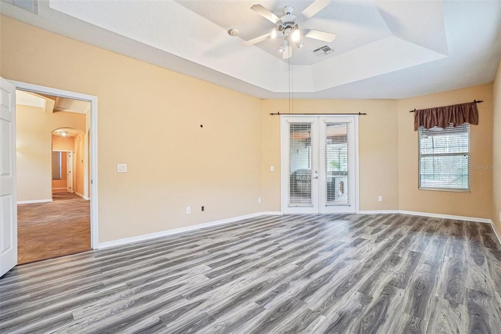 Large master suite with Brazilian hardwood and french doors out to the screen room