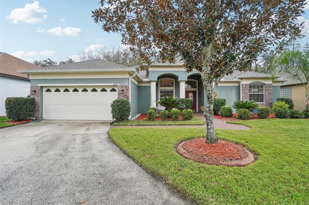 2 car garage with mature landscaping