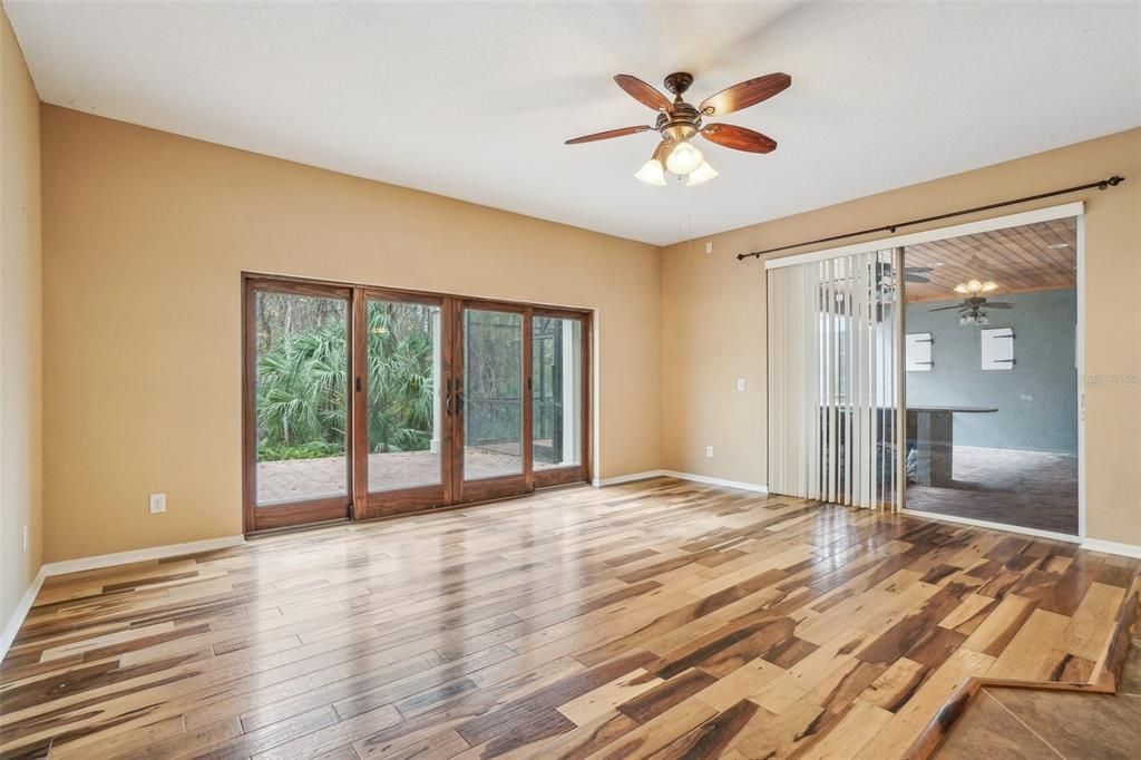 Family room also has sliding doors out to the large screen room with summer kitchen