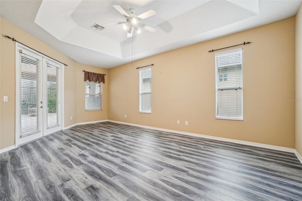 Primary bedroom with tray ceiling