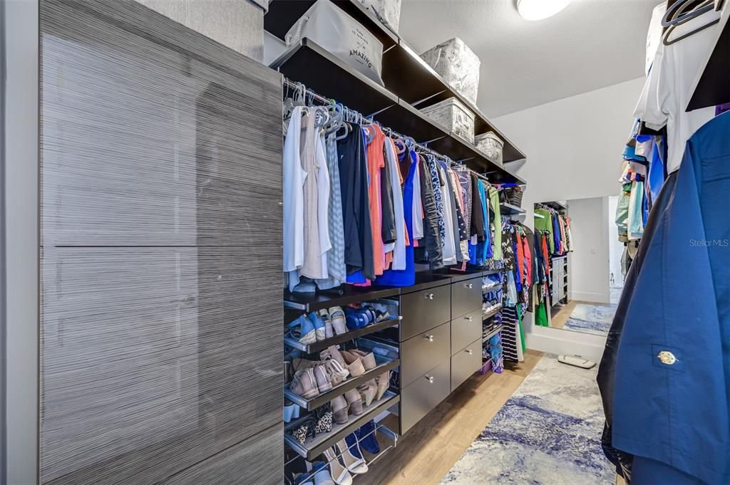 primary closet with custom shelving