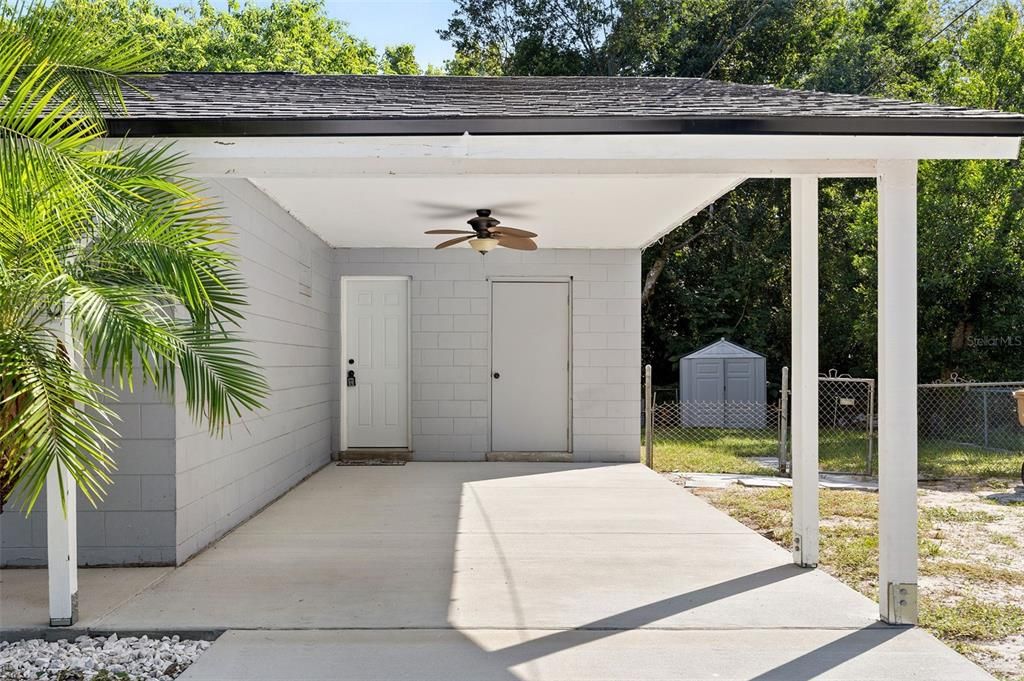 Carport with access to laundry room.