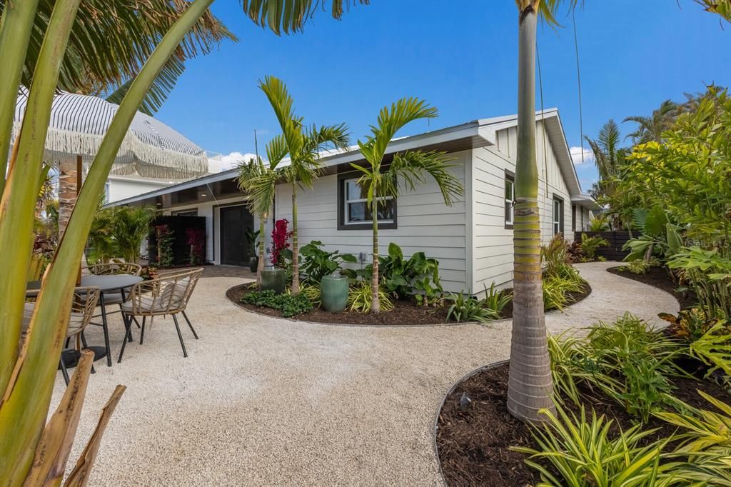 Pebble walkway taking you to the backyard oasis