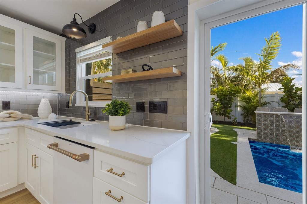 Enjoy the views of the resort style pool area from the kitchen