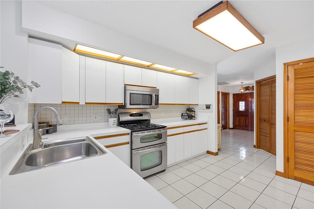 Tons of cupboards and a large pantry provide ample storage space.