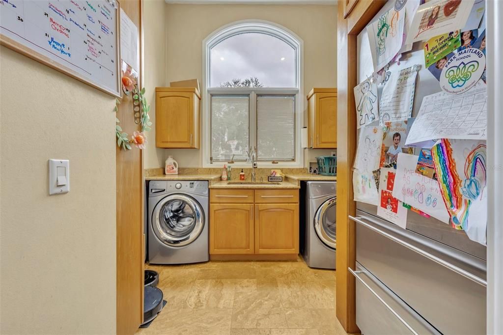 Laundry room with additional refrigerator