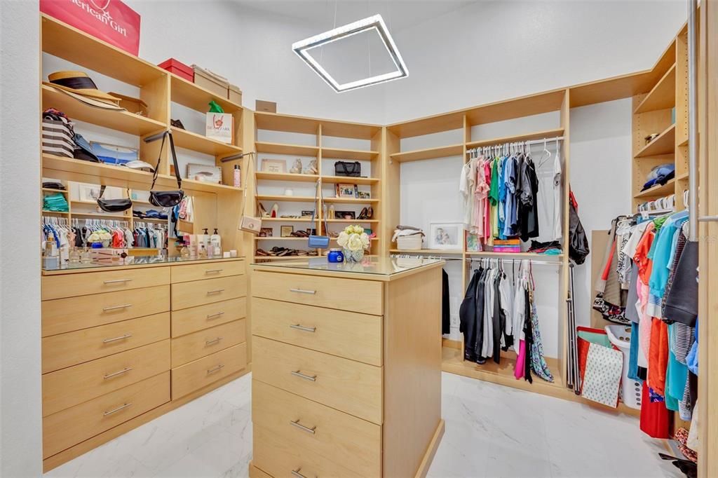 Primary bedroom closet for her