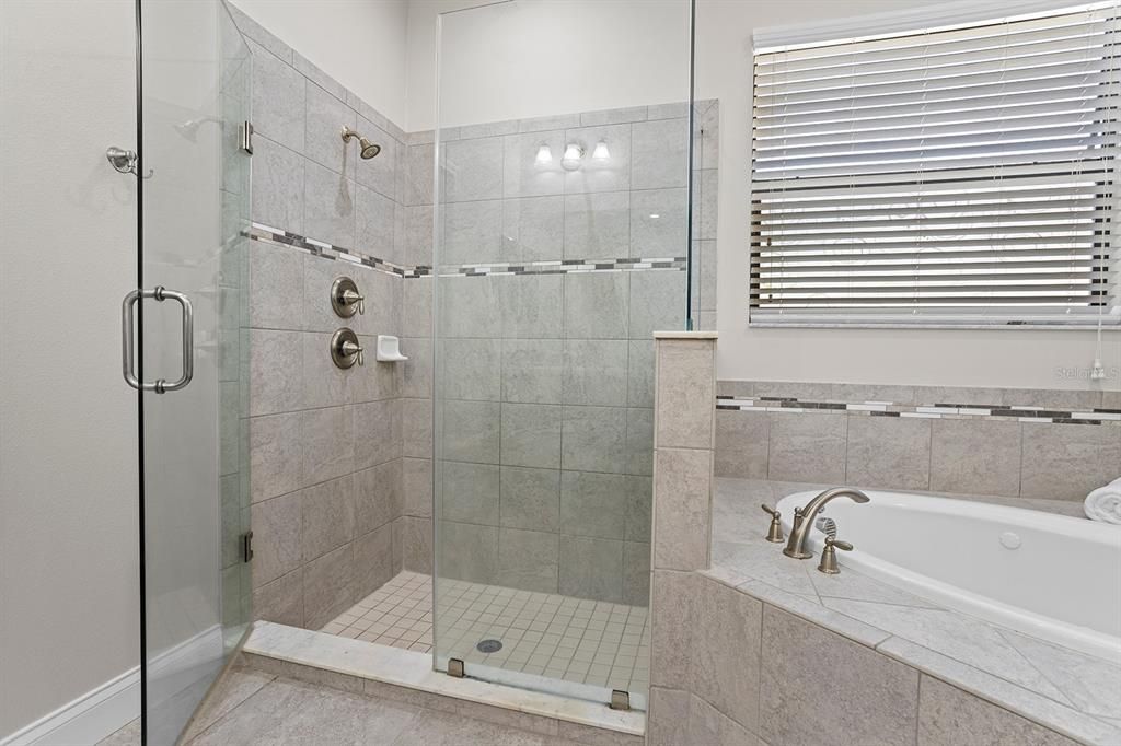 Primary walk-in shower and garden tub