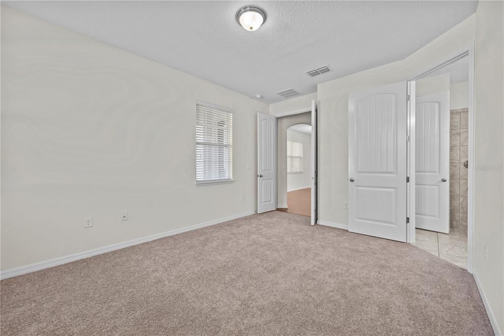 Main Bedroom - double door to access it. New carpet