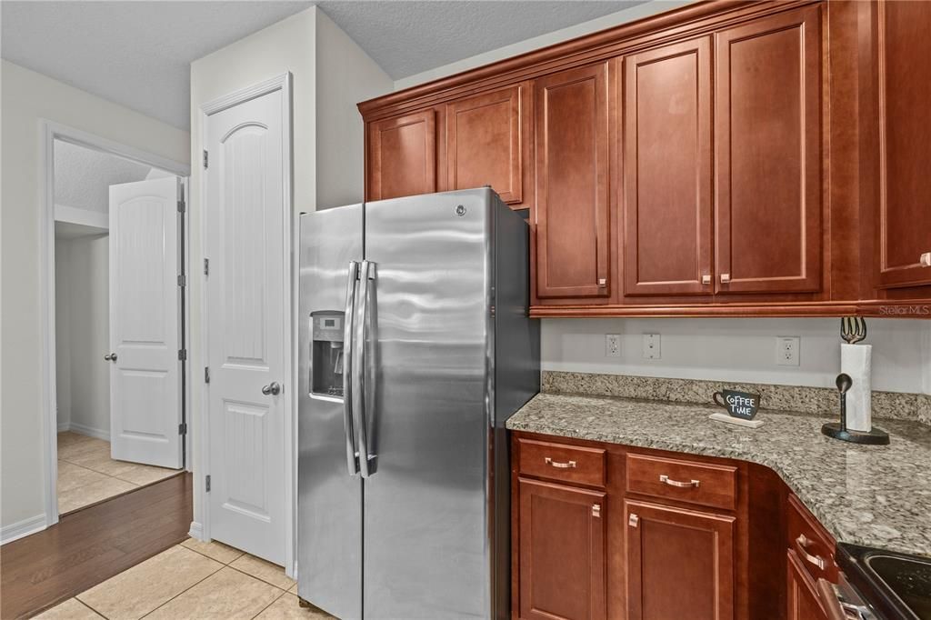 Kitchen and door to the half bathroom in the first floor