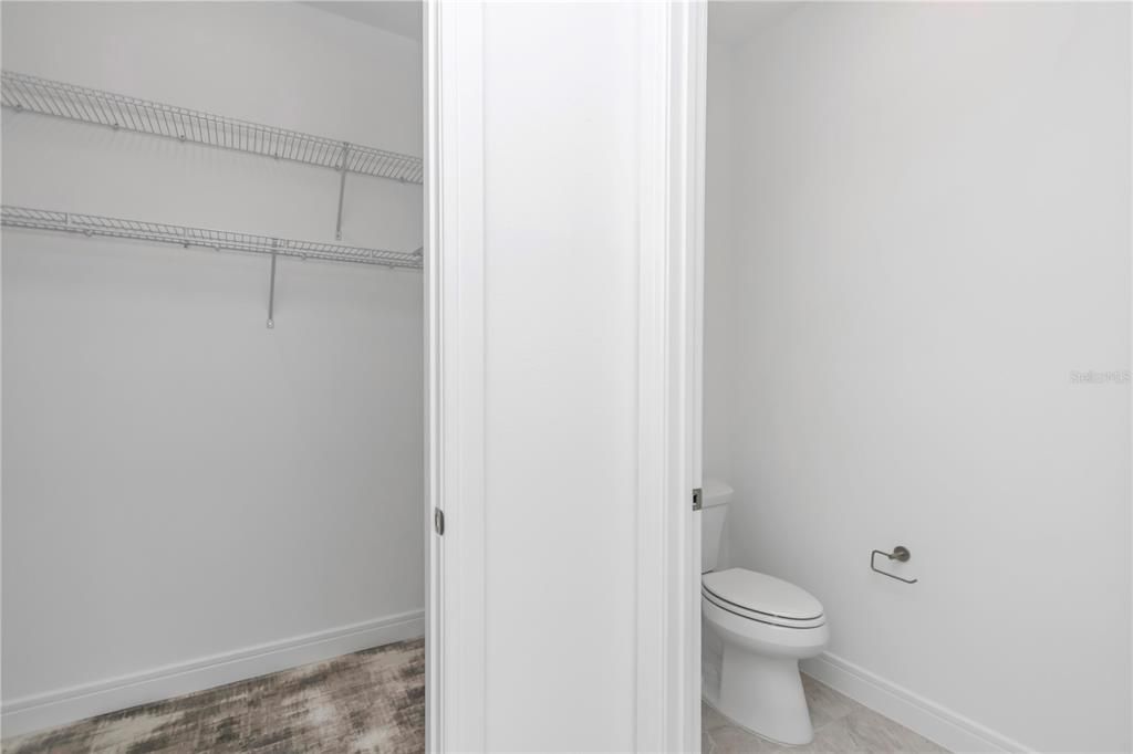 Guest Bathroom with water closet and walk in closet