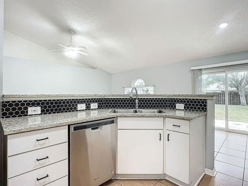 Kitchen view 1: SS Appliances-Granite Countertops