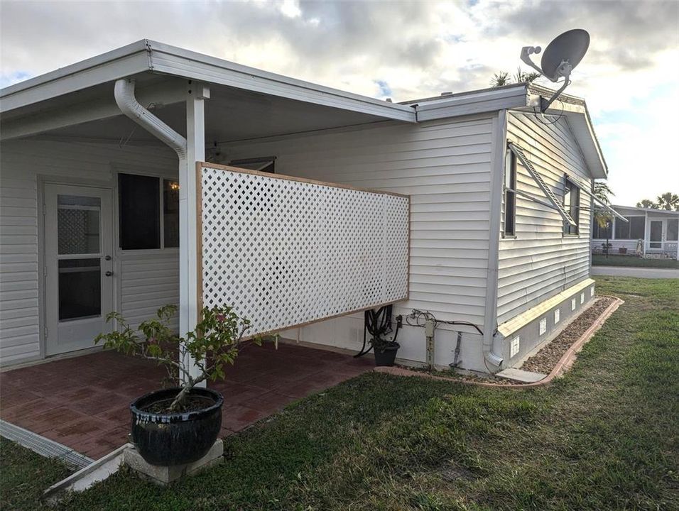 1044 Back side view of concrete edging and custom shutters