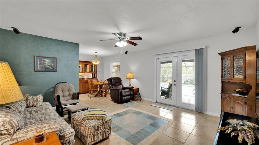 Looking from hallway into living room and porch deck