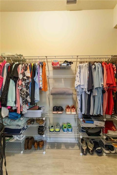 Primary Bedroom walk-in closet