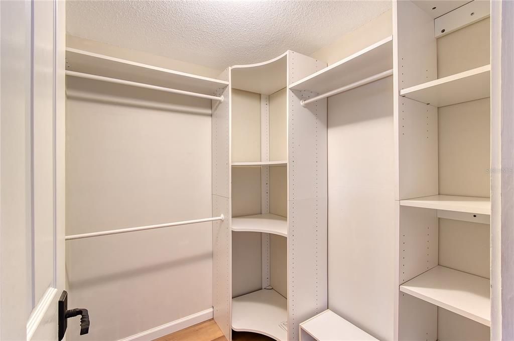 Primary Bedroom Walk-In Closet, Luxury Vinyl Plank Flooring